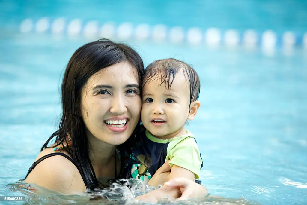 Instructor helping kids in a specialty swim class